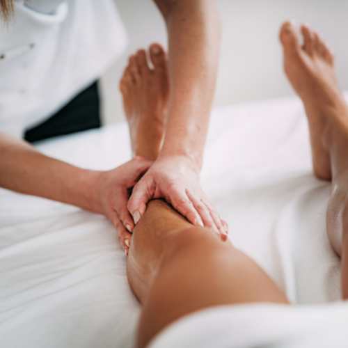 sports massage therapy being carried out on a womans leg
